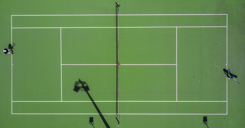 Two Person Playing Tennis